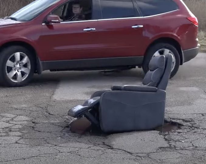chair sitting in pothole